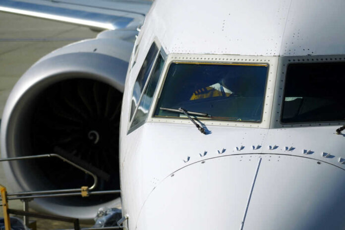 2409321735 Airplane cockpit and engine close up view