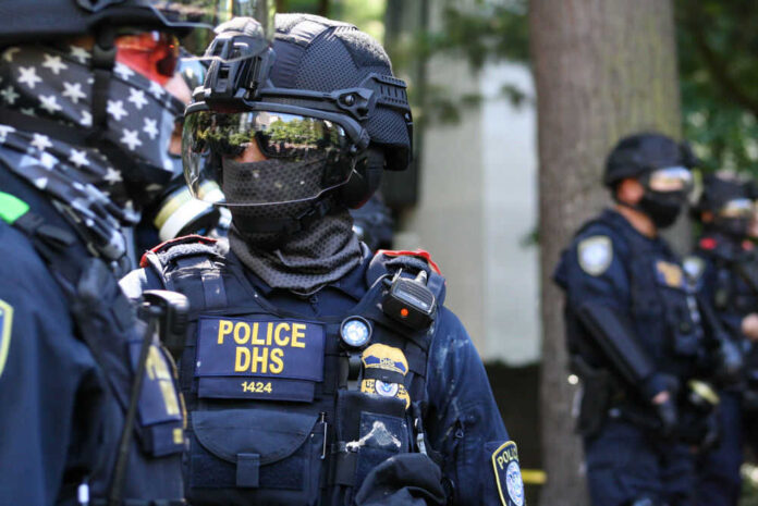 Riot police in tactical gear with face masks